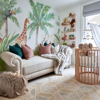 gender neutral nursery with safari and palm tree wall mural with chaise sofa