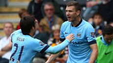 Edin Dzeko of Manchester City celebrates with team-mates after scoring in Hull vs Man City match