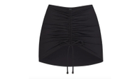 SKIMS Ruched Mini Skirt
RRP: $54
The true-to-size front-ruched skirt, in sizes XXS to 4X, allows you to adjust for your ideal coverage