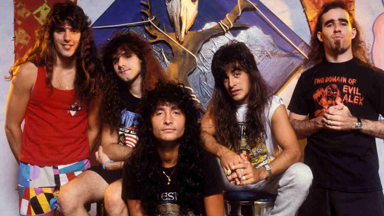 Anthrax posing for a photograph in front of a skull backdrop