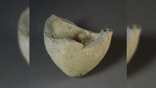 The remains of a sphero-conical ceramic vessel found in Jerusalem that researchers suspect was used as a hand grenade during the Crusades.