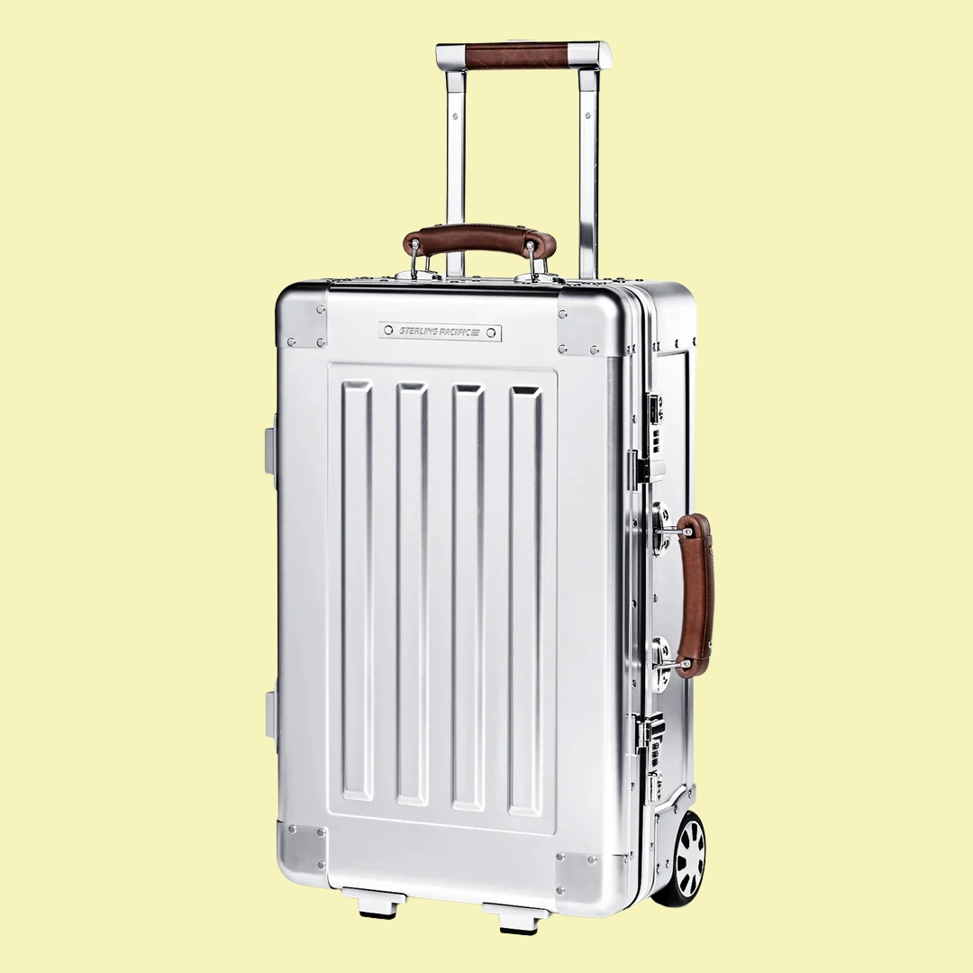Aluminum Sterling Pacific 35L Cabin Travel Case against a pale yellow background.