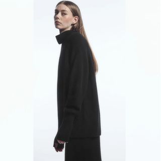 COS model wearing black turtleneck sweater
