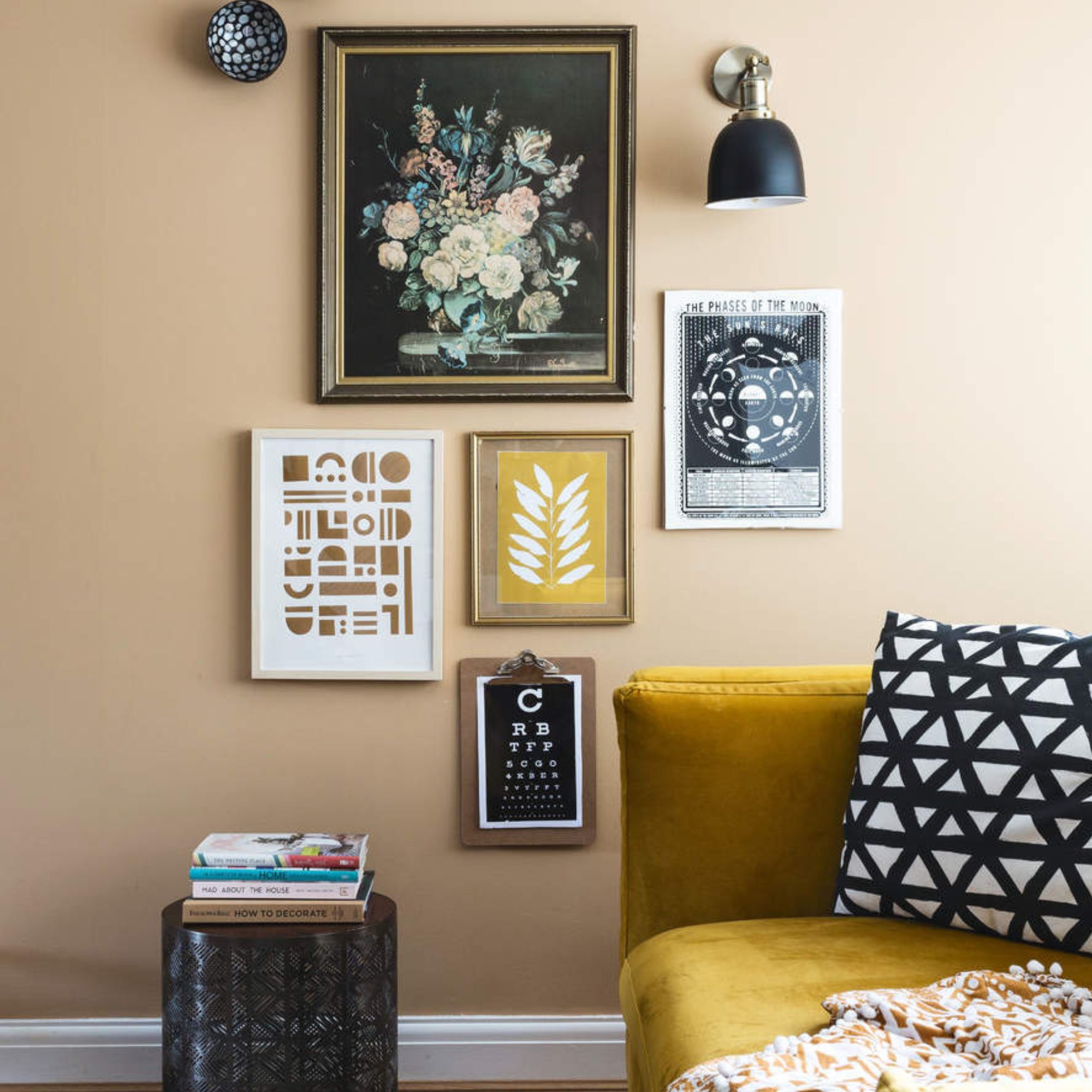 A gallery weall, including a zodiac-inspired passes of the moon print