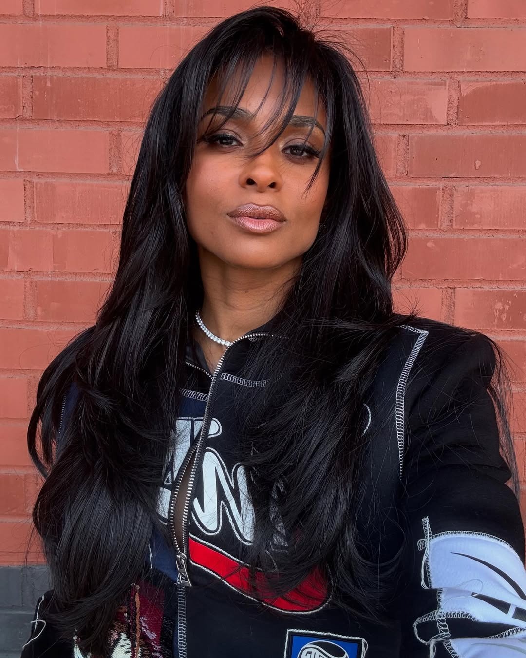 Singer Ciara with long, wispy bangs.
