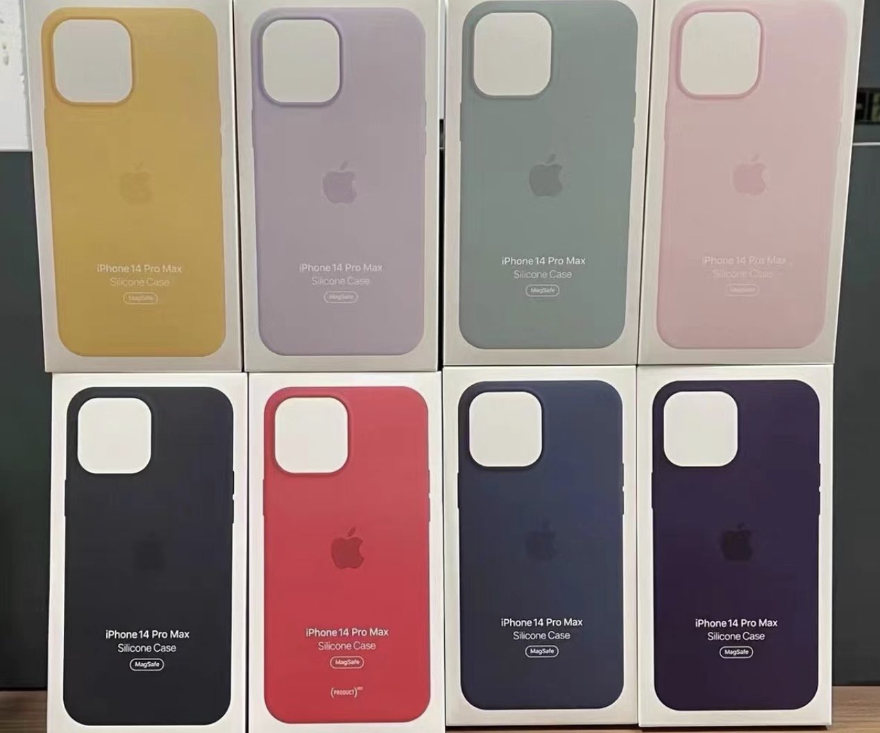 A photo of iPhone 14 Pro Max reproduction cases new in box, showing eight different colorways.