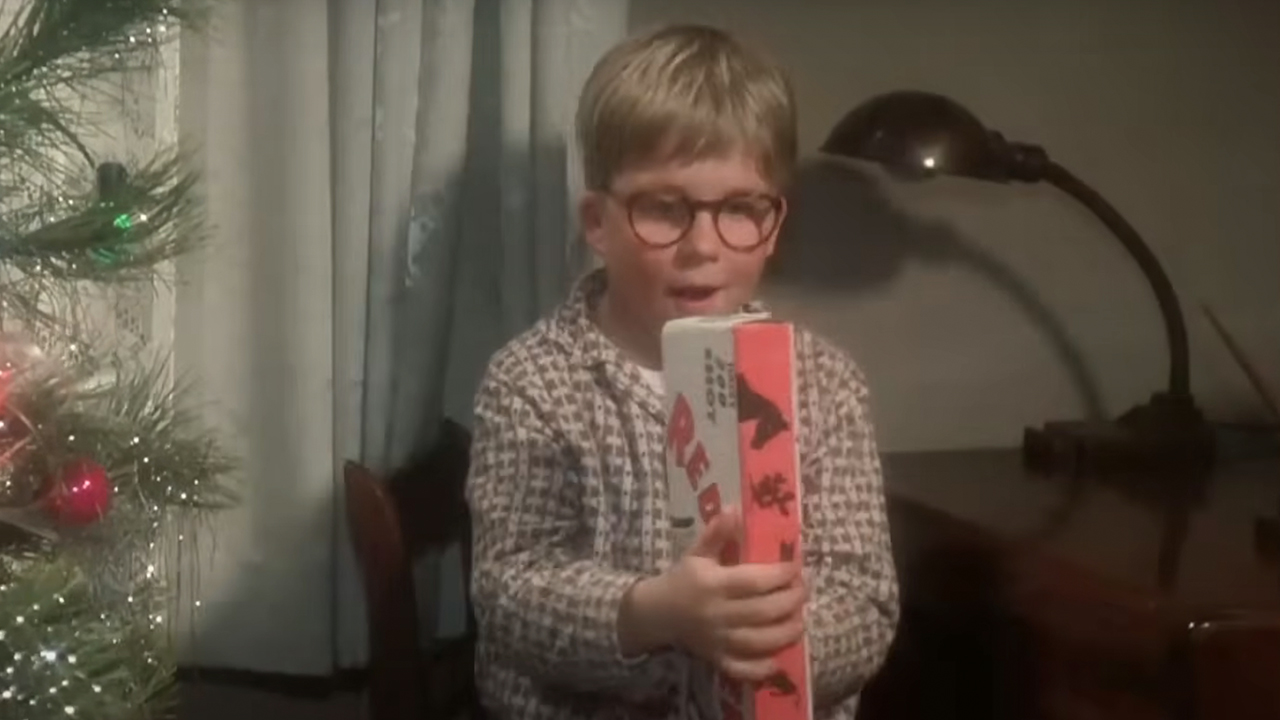 Ralphie opening his red rider bb gun in A Christmas Story