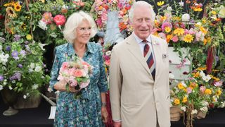 Prince Charles, Prince of Wales and Camilla, Duchess of Cornwall pose at The Sandringham Flower Show 2022