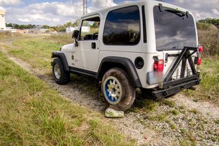 An Earth-bound Jeep is outfitted with a tire built from a "shape memory alloy," or a metal that springs back into its original shape after being deformed. The design could find its way onto a future Mars rover.