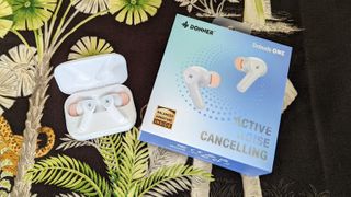 The Donner DoBuds One wireless earbuds with its packaging