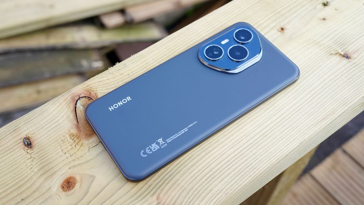 The Honor 400 Pro sat face down on a plank of wood showcasing the rear design