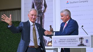 PGA Tour Commissioner, Jay Monahan, presents Gary Koch with the Payne Stewart Award prior to the Tour Championship at East Lake Golf Club on August 22, 2023
