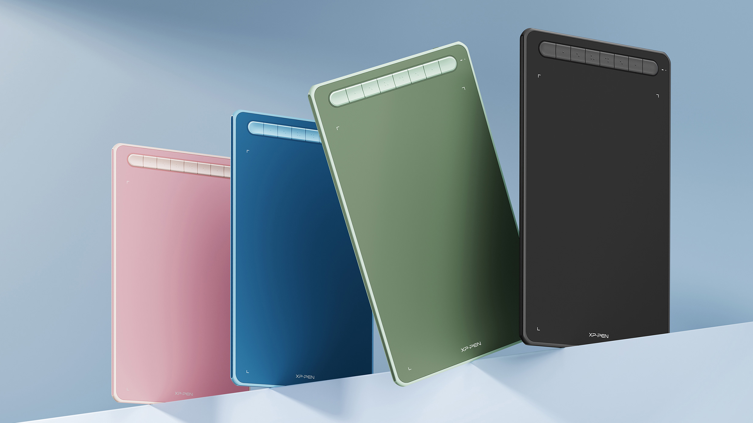 A photo of drawing tablets in various colours from XP-Pen