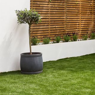 sunken garden makeover with fake grass