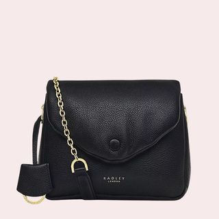 flat lay of black cross over bag