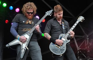 Brent Hinds (L) and Bill Kelliher of American heavy metal band Mastodon live on stage at Sonisphere Festival, August 2, 2009.