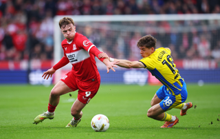 Tommy Conway of Middlesbrough is challenged by Tom Fellows of Southampton during the Sky Bet Championship Play Off Semi Final Second Leg match between Middlesbrough and Southampton at Riverside 