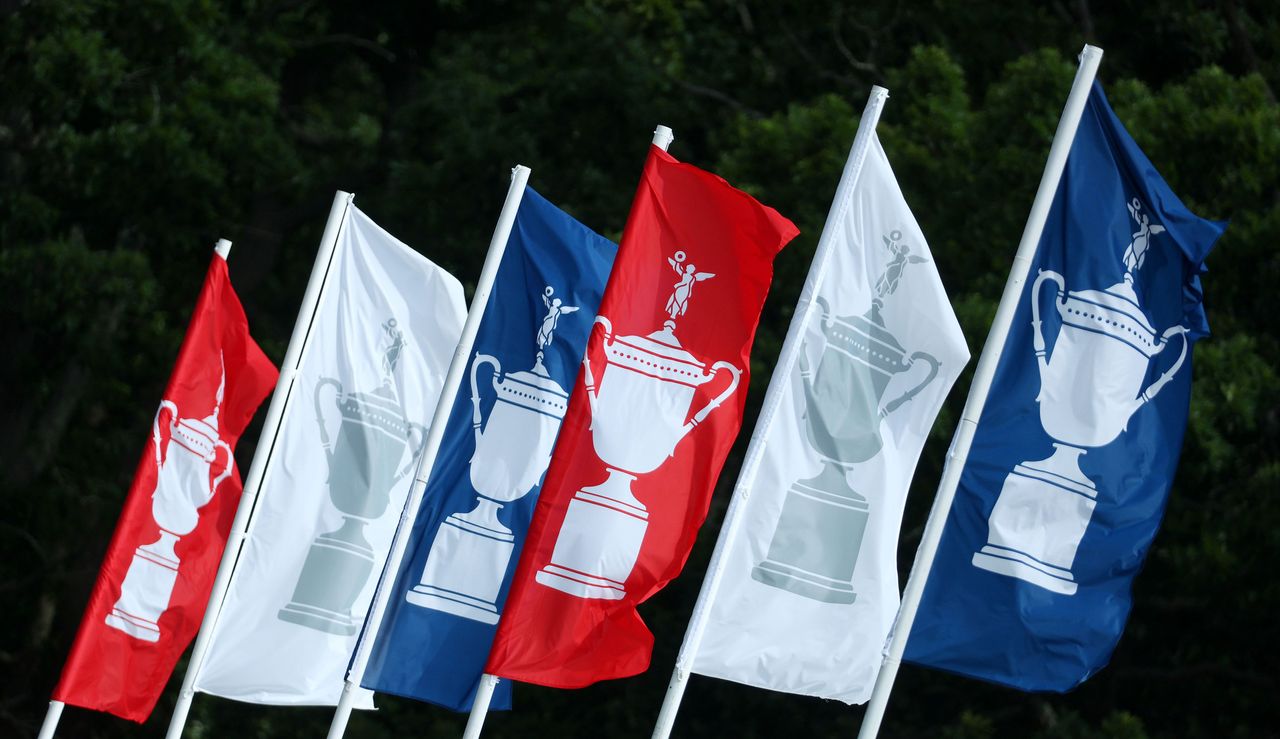 Multiple US Open flags wander in the wind