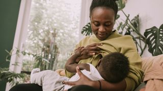 Breastfeeding a baby by a woman