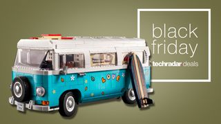 A Lego camper van with flowers and "Love" drawn onto it by a sign saying Black Friday