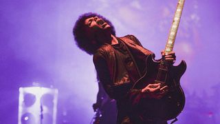 Prince playing guitar