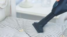 Cleaning a mattress topper with a vacuum