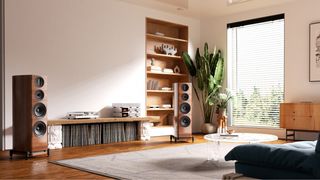 Wharfedale Elysian 4R floorstanders in walnut next to a rack