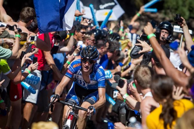 Rory Sutherland (UnitedHealthcare) climbs through massive crowds outside of Boulder at the USA Pro Challenge in Colorado.