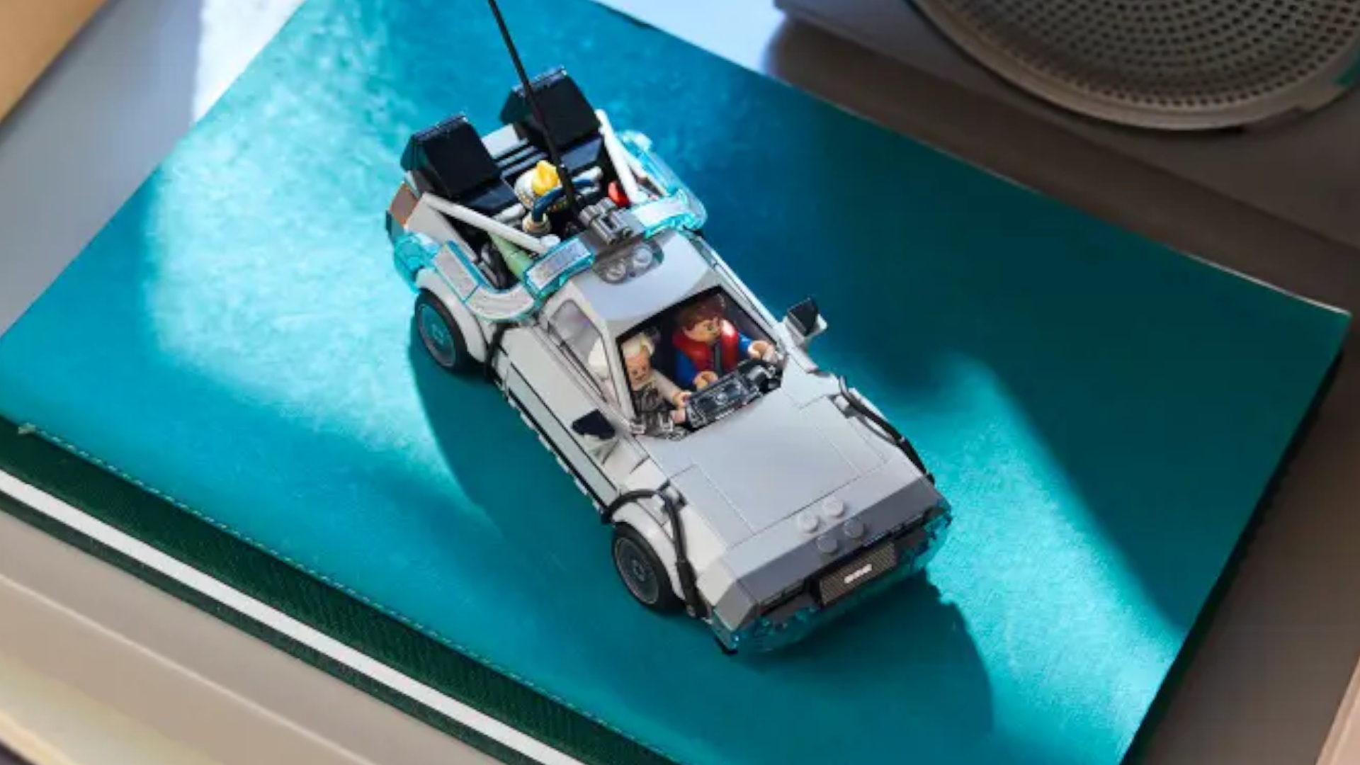 Lego Time Machine from Back to the Future set seen on a blue surface from above