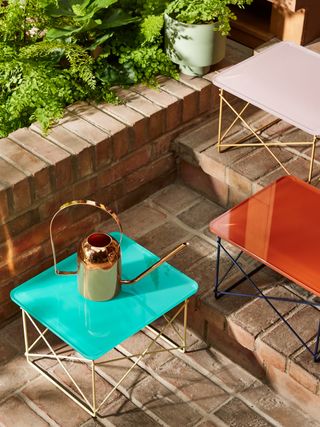 Eames tables by Herman Miller and Hay outdoors