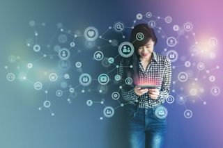 A happy woman holding a device surrounded by a cloud of icons indicating good customer experience