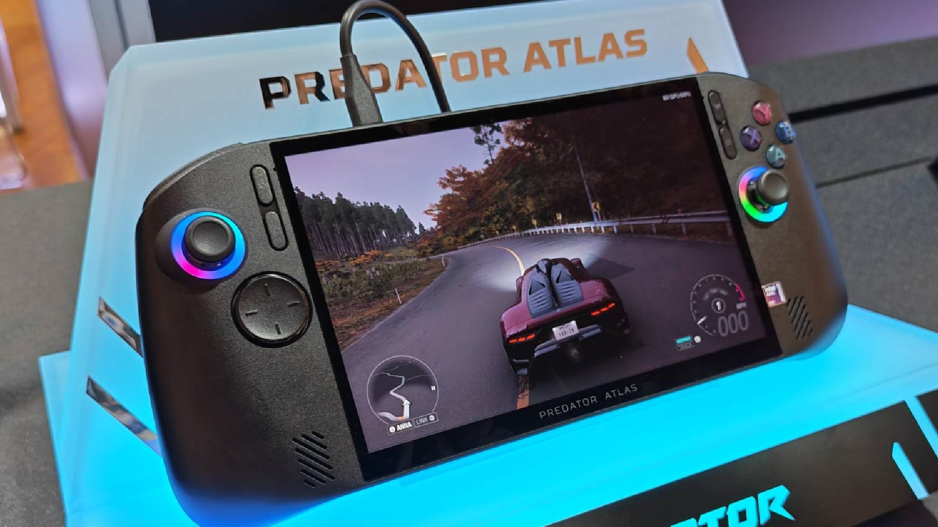 Photo of Acer Predator Atlas 8 handheld on acrylic stand.