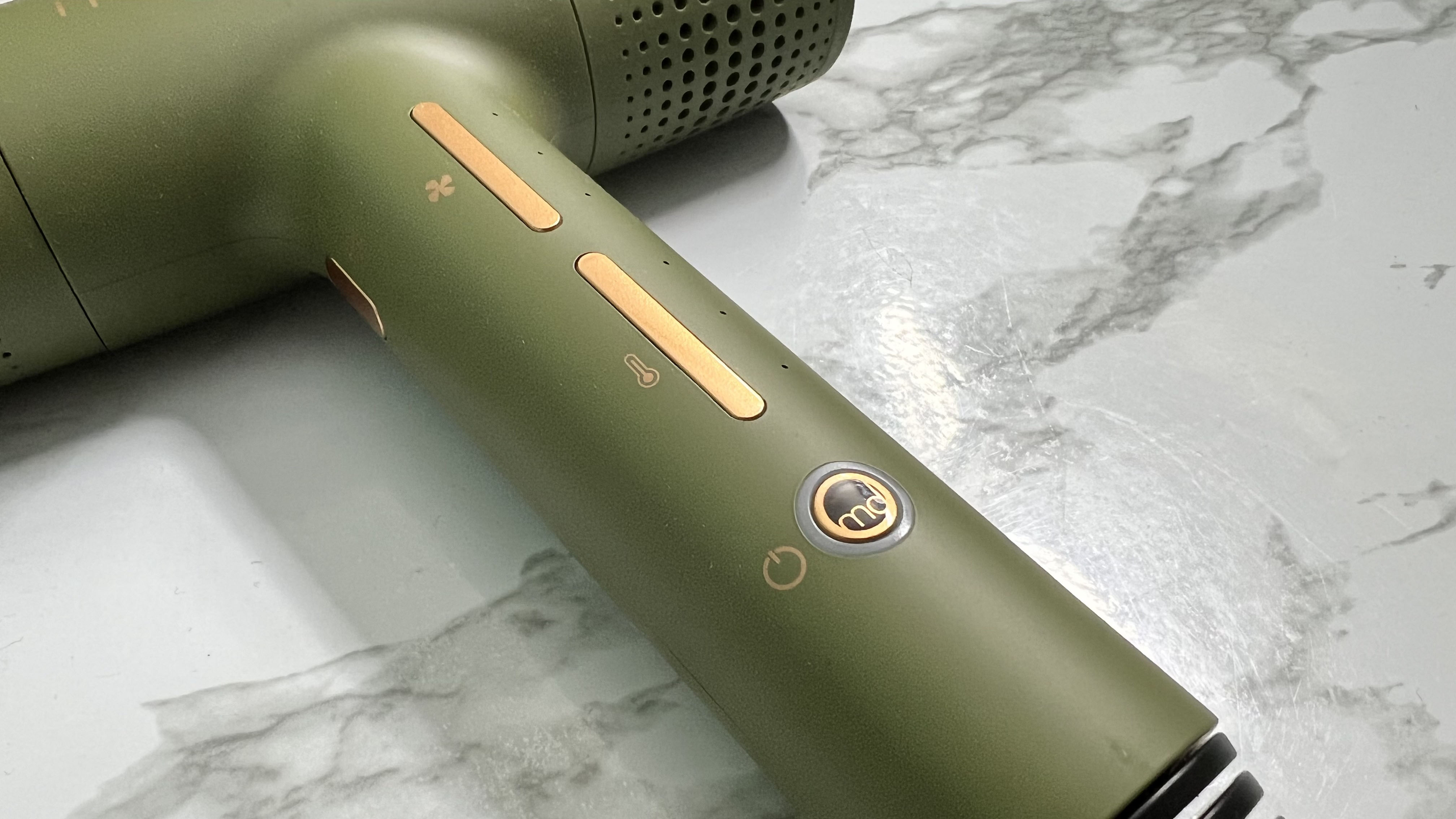 A closeup image of the buttons on the mdlondon BLOW hair dryer
