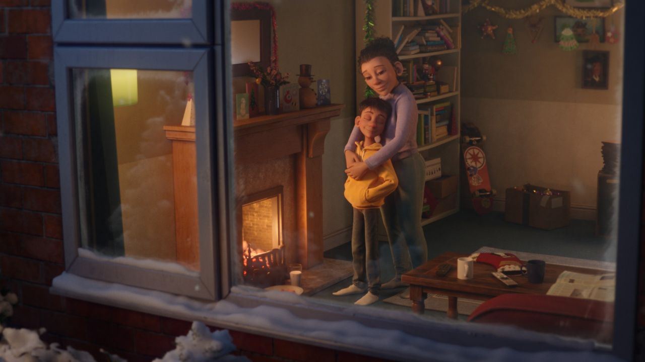 McDonald&#039;s UK Christmas Advert 2020, boy and his mother embracing in cosy living-room