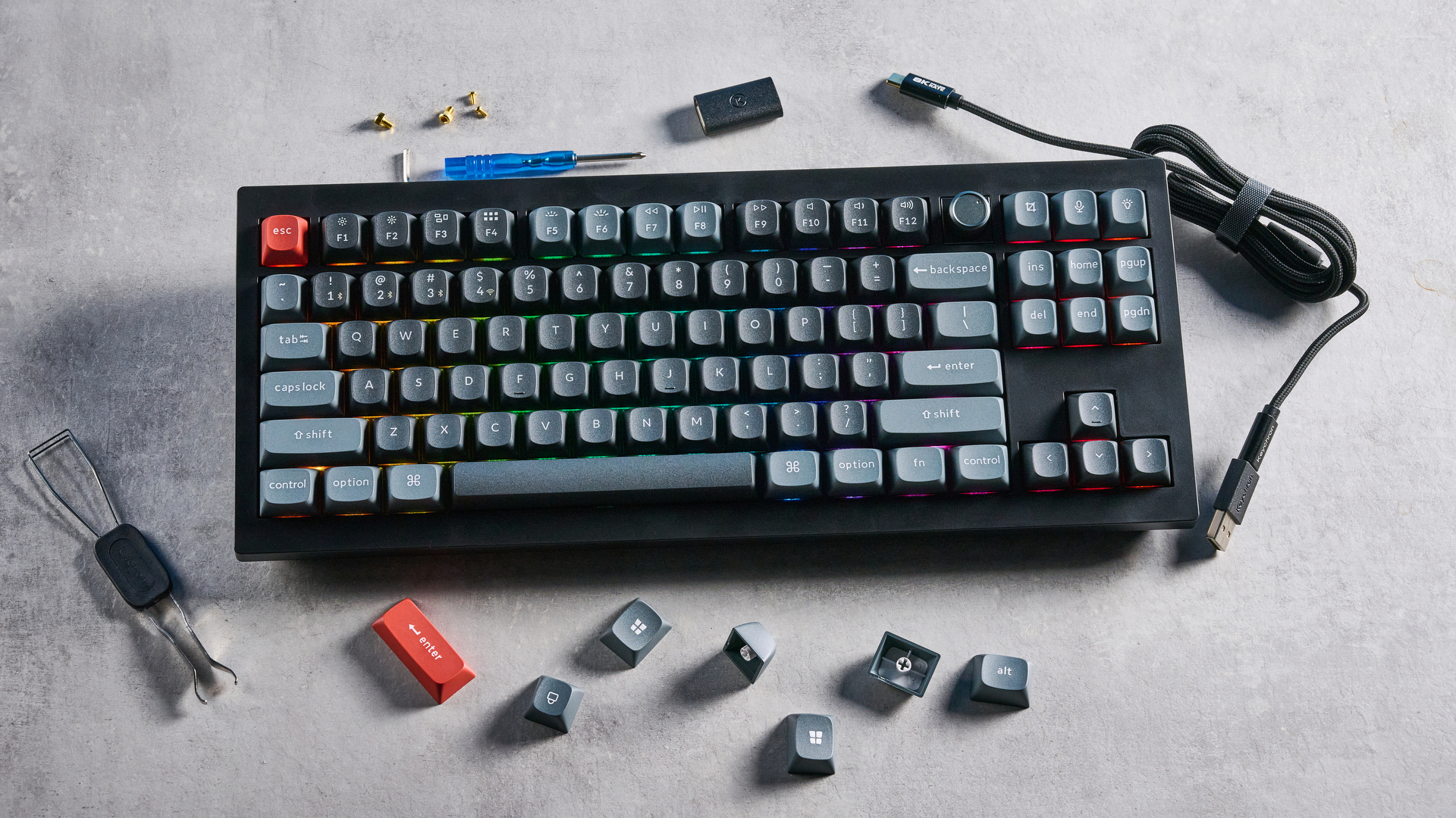 Keychron V3 Ultra 8K photographed on a grey table top in front of a blue background