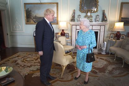 Meghan and Harry photo behind the Queen and Boris Johnson