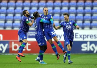 Kal Naismith (second right) netted a brace for Wigan (Martin Rickett/PA).