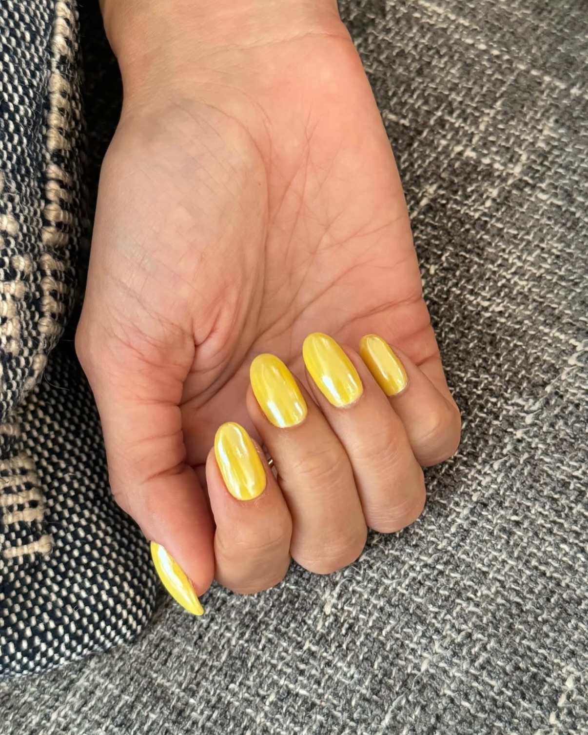 Yellow chrome nails.