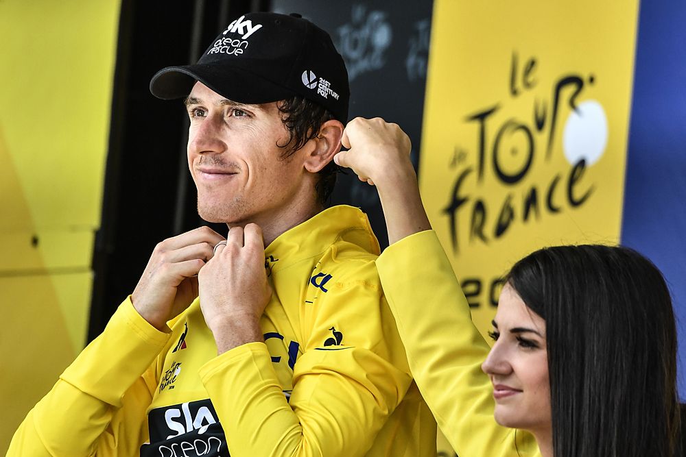 Geraint Thomas (Team Sky) puts on the yellow jersey after stage 20 at the Tour de France