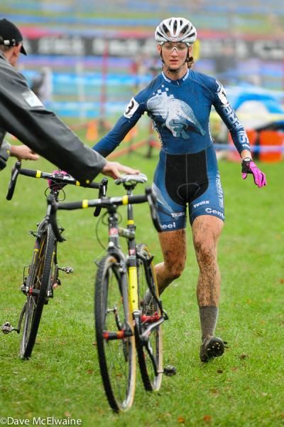 A racer takes a new bike in the pits