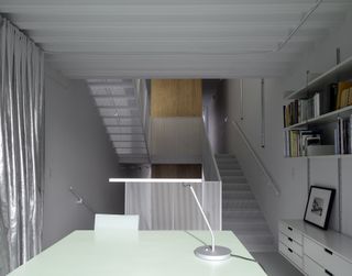 Study and utilitarian interior at Narrow House