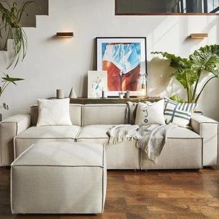 A cream corner modular sofa in a neutral living room