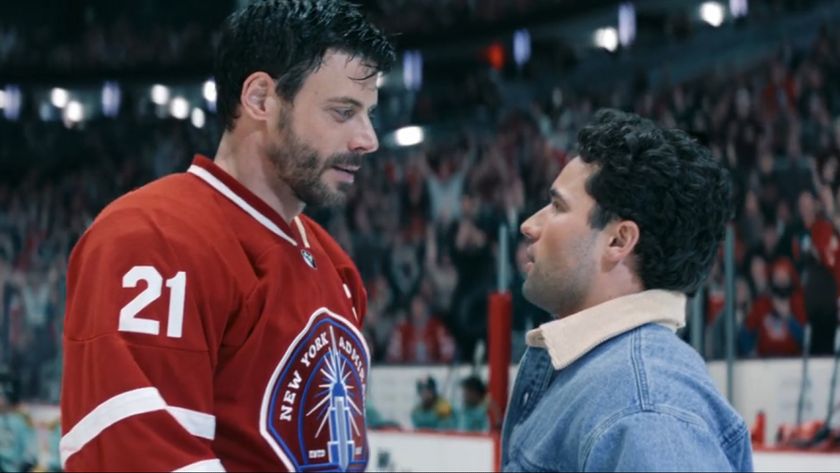 Heated Rivalry's Scott (Francois Arnaud) and Kip (Robbie G.K.) stand face to face on the ice after the Admirals win the cup. 