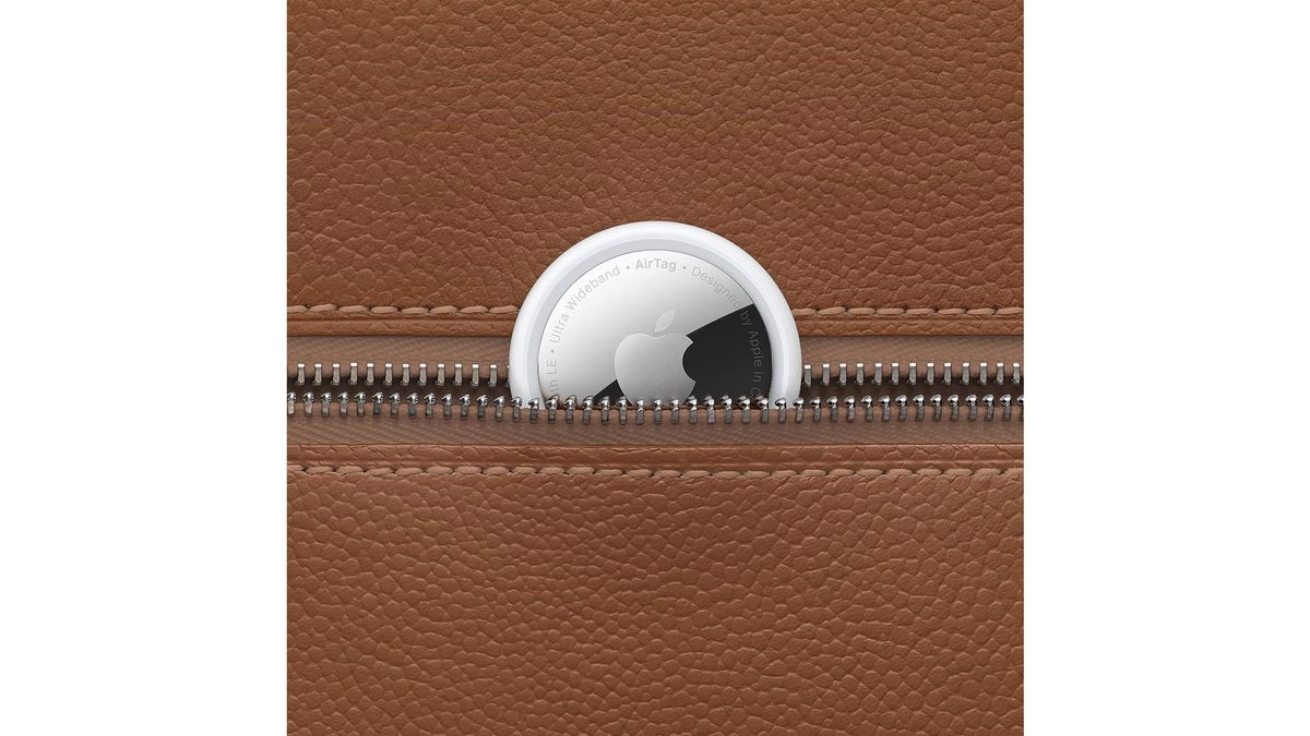 A small silver and black disk is shown against something else to highlight the scale and size of it, all on a white background.