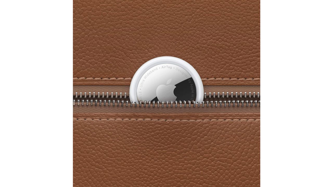A small silver and black disk is shown against something else to highlight the scale and size of it, all on a white background.