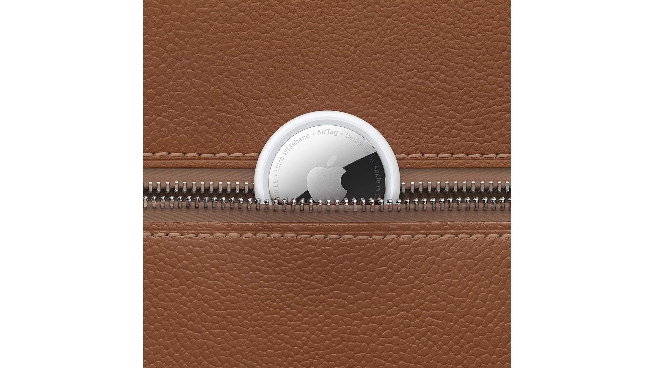 A small silver and black disk is shown against something else to highlight the scale and size of it, all on a white background.