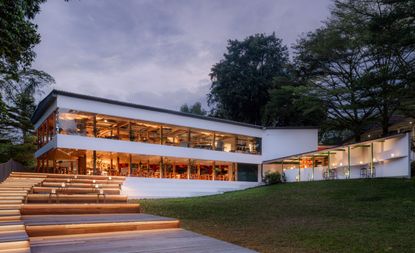 AIR CCCC Singapore restaurant and cooking club in a low building refurbished by OMA, amid trees
