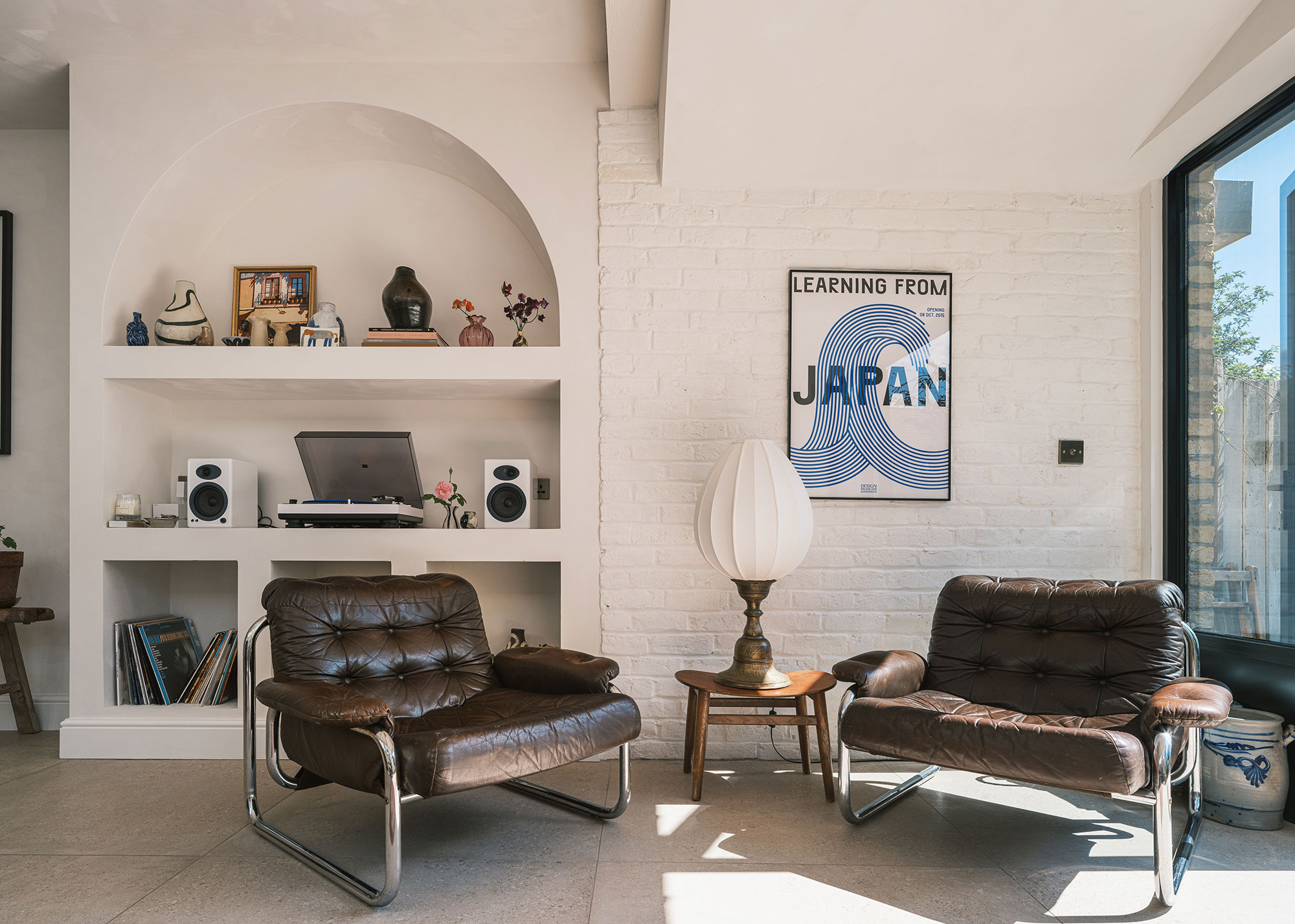 mid-century modern living room with alcove shelving and tiled floor