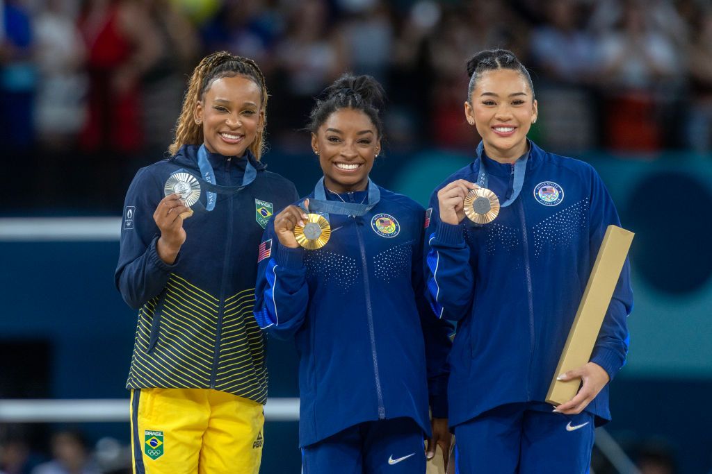 Silver medal winner Rebeca Andrade of Brazil, gold medal winner Simone Biles of the United States and bronze medal winner Sunisa Lee of the United States on the podium with their medals after the Artistic Gymnastics Individual All-Around Final for Women at the Bercy Arena during the Paris 2024 Summer Olympic Games on August 1st, 2024