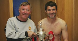 Sir Alex Ferguson and Roy Keane of Manchester United celebrate with the FA Cup in the dressing room after winning the AXA FA Cup Final between Manchester United and Millwall at the Millennium Stadium on May 22, 2004 in Cardiff, Wales.